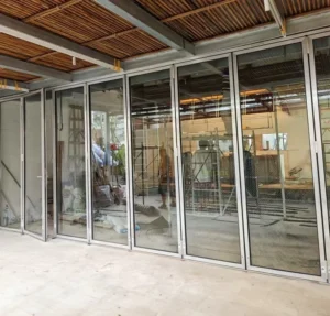 High Frequency Durable Silent Bi fold Exterior Entry Doors with Heavy Duty Hardware for Shops in Asia
